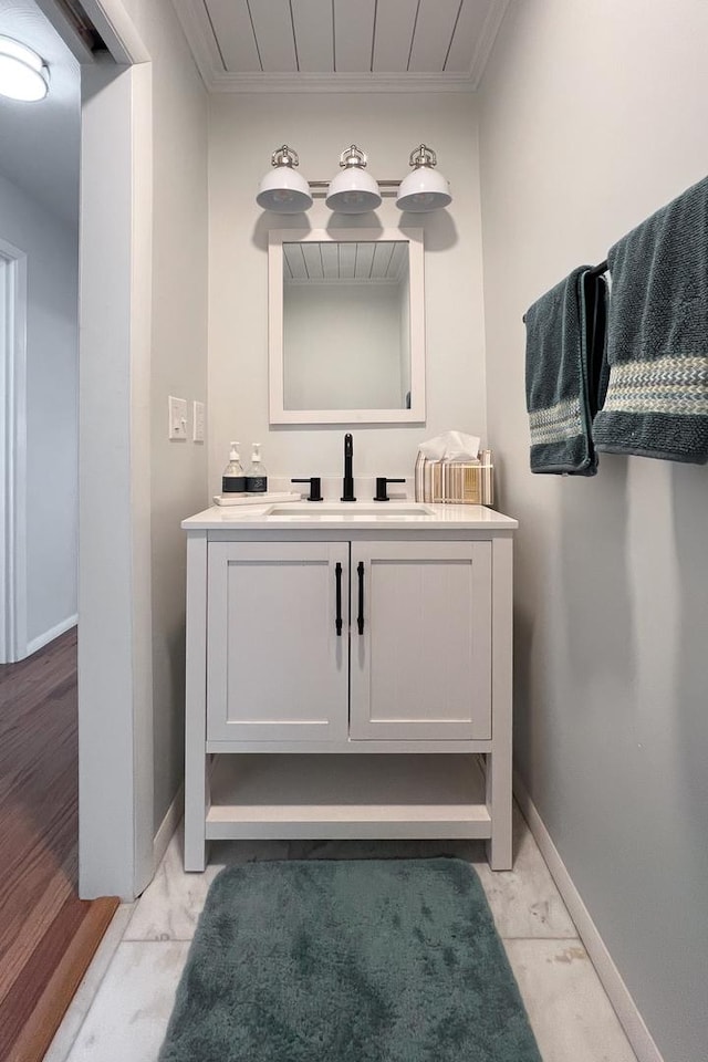 bathroom with vanity and crown molding