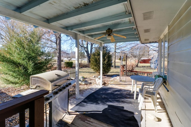 view of patio with area for grilling and ceiling fan