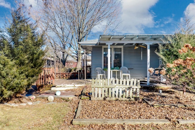 back of property featuring ceiling fan