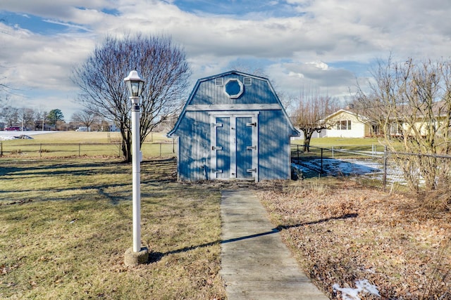 view of outbuilding with a yard