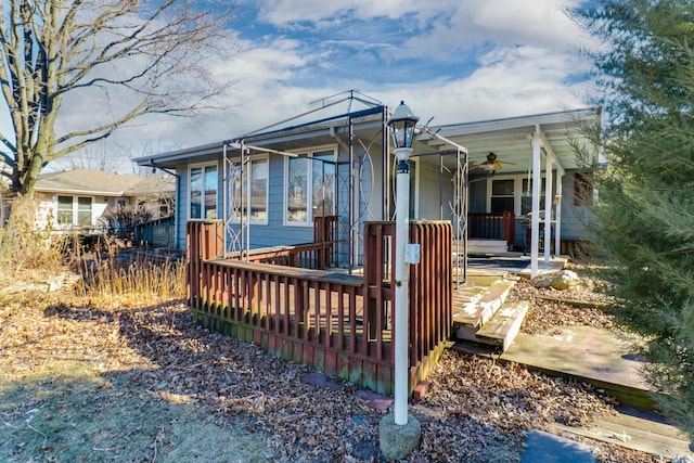 exterior space featuring ceiling fan