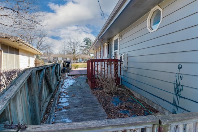 view of home's exterior featuring a wooden deck