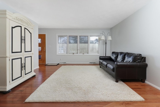 living room with dark hardwood / wood-style floors