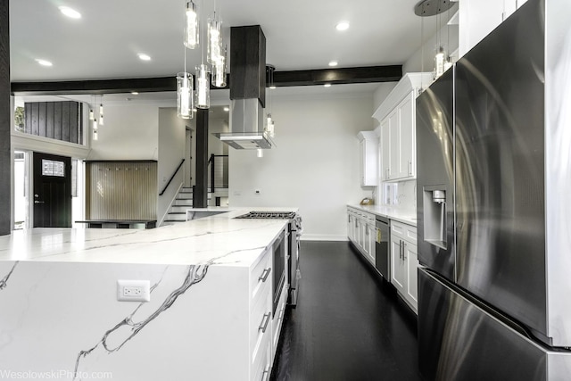 kitchen featuring stainless steel appliances, light stone countertops, hanging light fixtures, and white cabinets