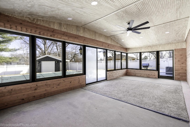 unfurnished sunroom with wood ceiling, ceiling fan, and vaulted ceiling