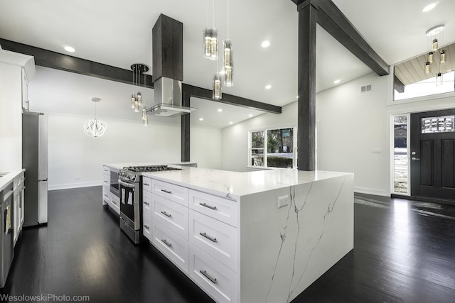 kitchen featuring hanging light fixtures, white cabinetry, appliances with stainless steel finishes, and beam ceiling