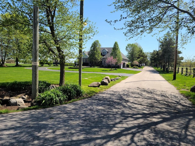 view of home's community with a yard