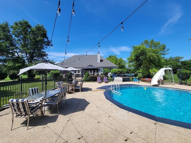 view of pool featuring a jacuzzi, a patio area, a gazebo, and a water slide