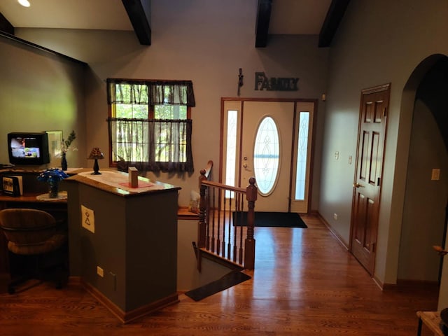 foyer entrance with hardwood / wood-style floors and beamed ceiling