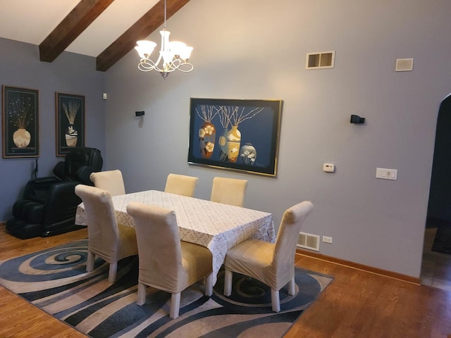 dining area featuring an inviting chandelier, high vaulted ceiling, dark hardwood / wood-style floors, and beamed ceiling