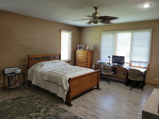 bedroom featuring ceiling fan and wood-type flooring