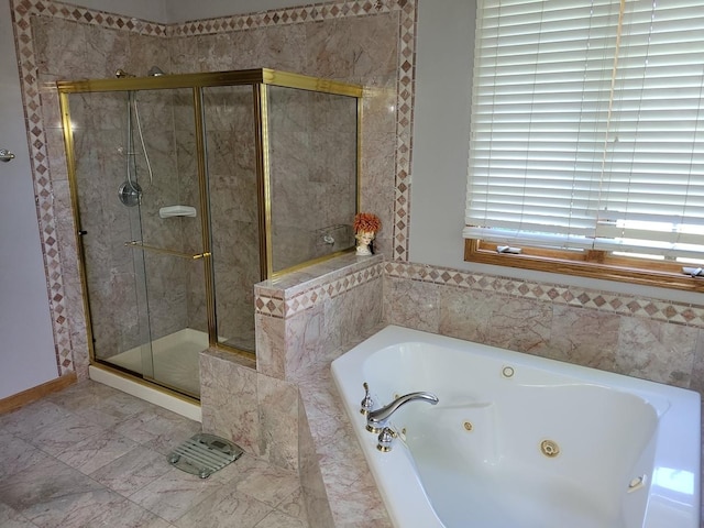 bathroom featuring shower with separate bathtub