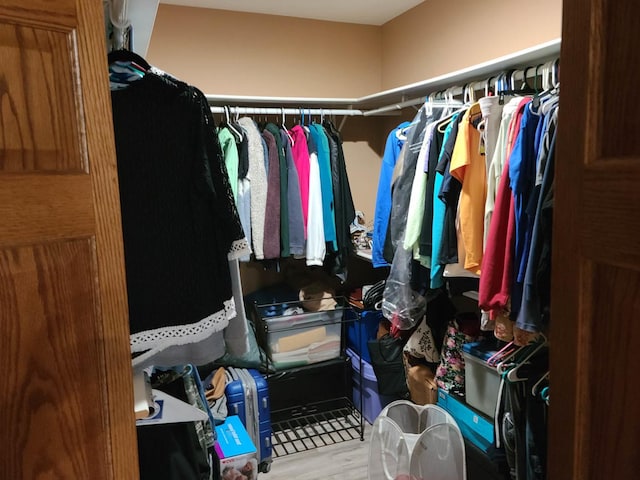 spacious closet featuring light wood-type flooring