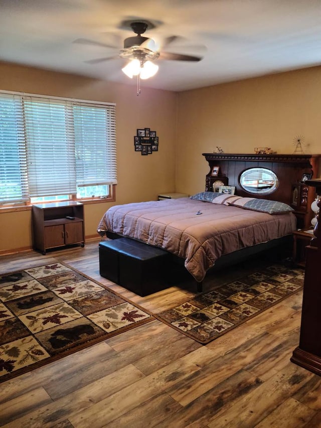 bedroom featuring hardwood / wood-style flooring and ceiling fan