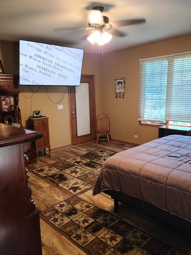 bedroom featuring hardwood / wood-style floors and ceiling fan