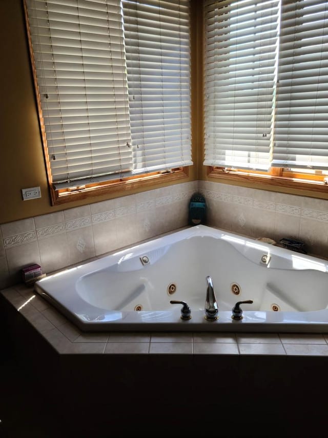 bathroom featuring tiled bath