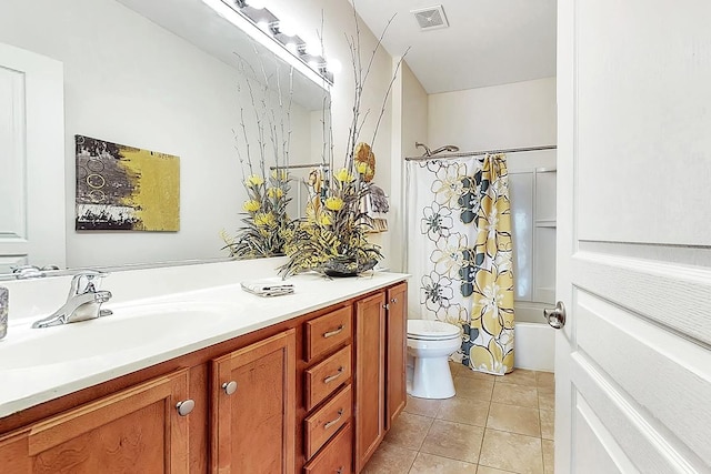 full bathroom featuring vanity, shower / tub combo, tile patterned floors, and toilet