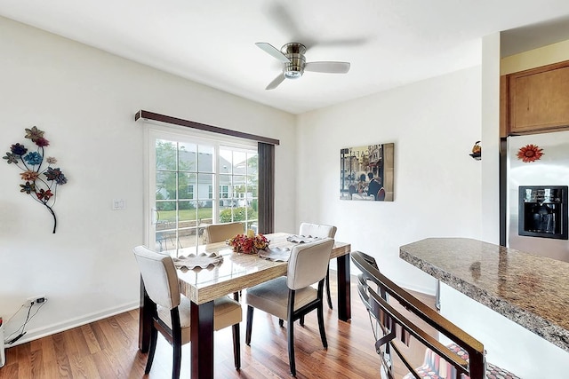 dining area featuring hardwood / wood-style flooring and ceiling fan