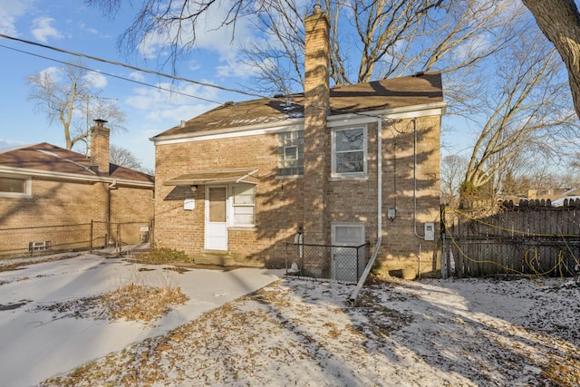 view of snow covered house