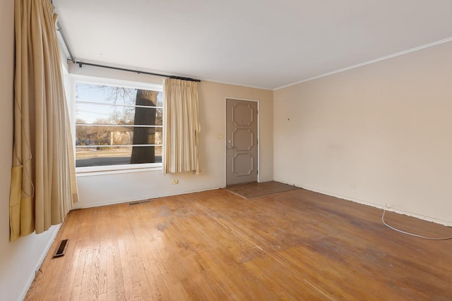 spare room with hardwood / wood-style floors