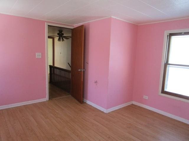 spare room featuring light hardwood / wood-style flooring