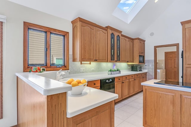 kitchen featuring light tile patterned flooring, lofted ceiling with skylight, black appliances, backsplash, and kitchen peninsula