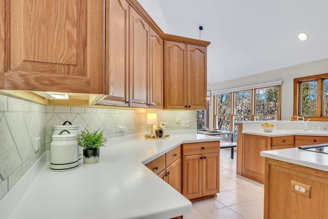 kitchen featuring tasteful backsplash and light tile patterned floors