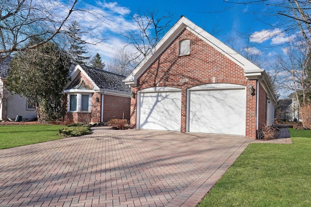 view of front property with a garage and a front yard