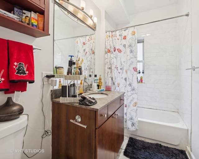 full bathroom featuring shower / bath combination with curtain, vanity, and toilet