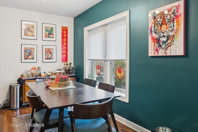 dining room with dark hardwood / wood-style floors