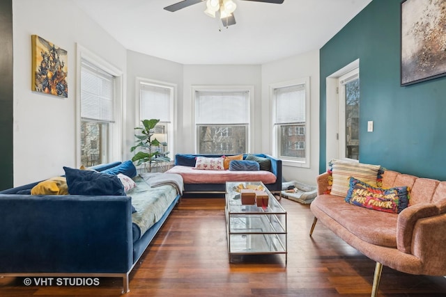 living room featuring ceiling fan, plenty of natural light, and dark hardwood / wood-style floors