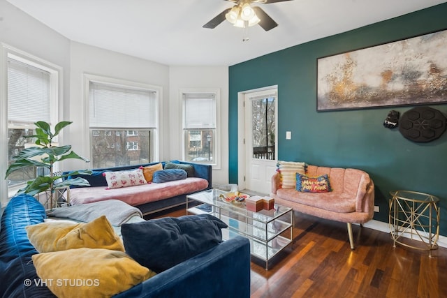 living room with dark hardwood / wood-style floors and ceiling fan