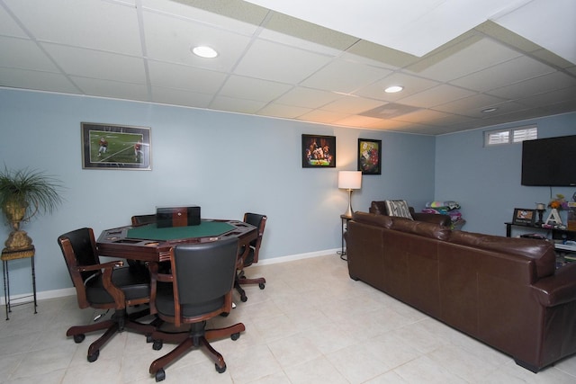 interior space with a paneled ceiling