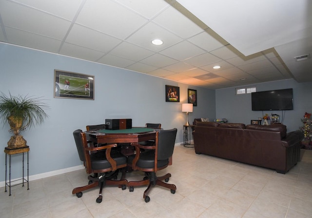 dining area with a drop ceiling