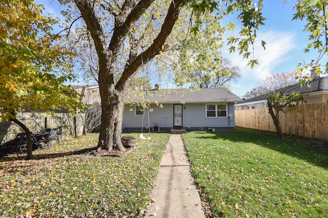 ranch-style home with a front yard