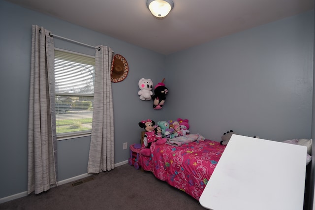 carpeted bedroom with multiple windows