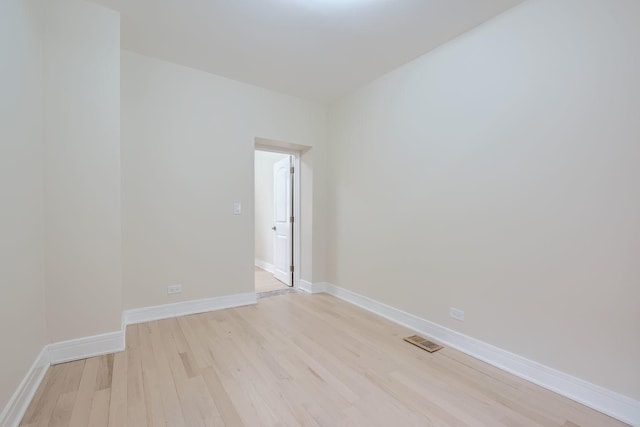 spare room with light wood-type flooring