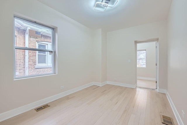 spare room with light hardwood / wood-style floors