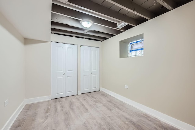 basement featuring light hardwood / wood-style flooring