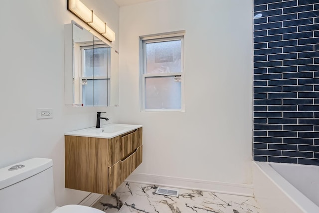 full bathroom featuring vanity, washtub / shower combination, and toilet