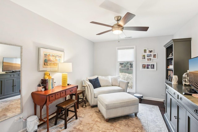 sitting room featuring ceiling fan