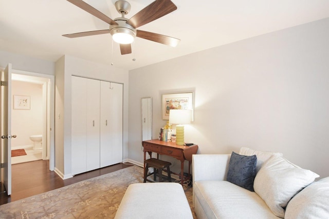 interior space featuring dark wood-type flooring and ceiling fan