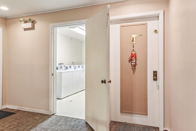 doorway to property featuring washer and clothes dryer