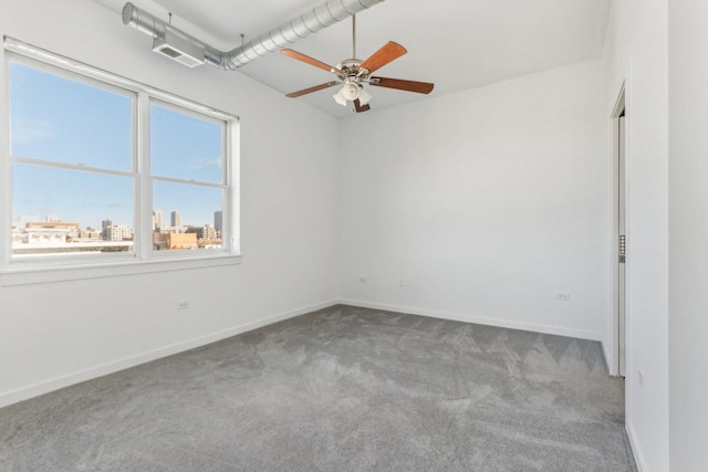 unfurnished room featuring ceiling fan and light carpet