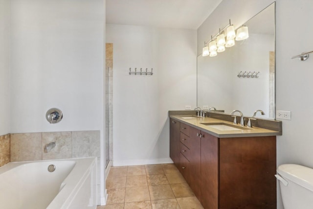 full bathroom with tile patterned flooring, vanity, shower with separate bathtub, and toilet