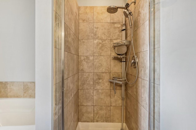 bathroom with tiled shower