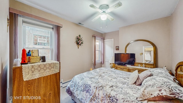 bedroom featuring baseboard heating and ceiling fan