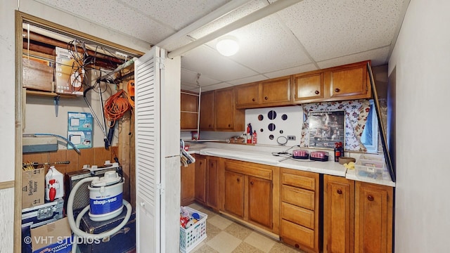 kitchen featuring a drop ceiling