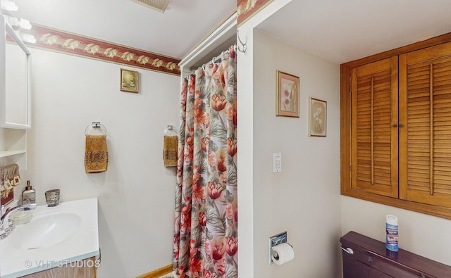 bathroom with vanity, toilet, and a shower with shower curtain