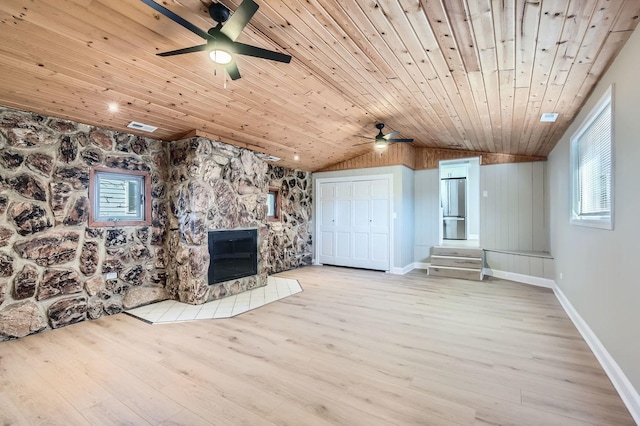 unfurnished living room with light wood-type flooring, a fireplace, and wood ceiling